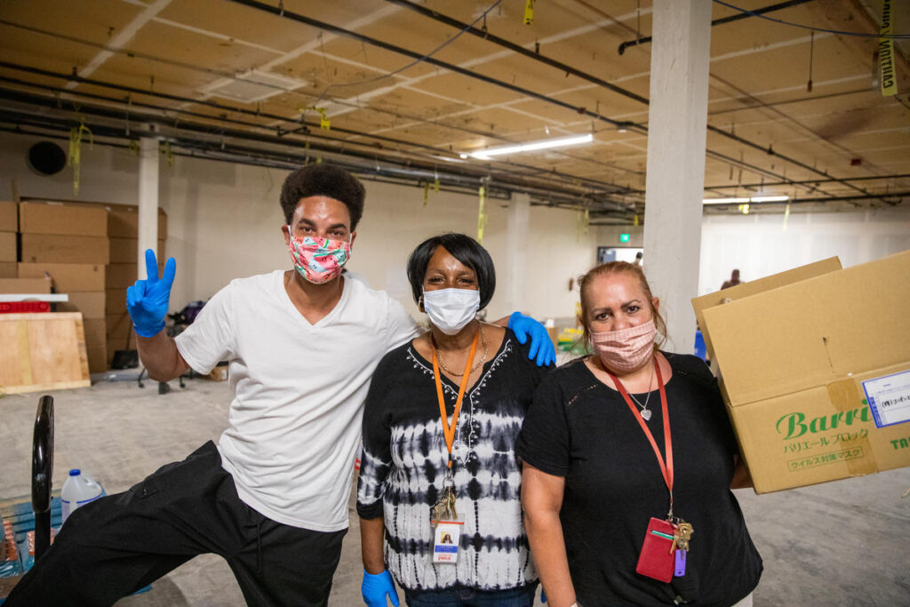 United Way of King County staff and volunteers work in a distribution center in South Seattle, WA on July 30, 2020. Through the PowerOf partners and DonorsChoose, community members can help Seattle school teachers and the communities they serve through volunteer opportunities and donations. PowerOf is centered around facilitating community involvement and specifically helping areas impacted by COVID-19.
