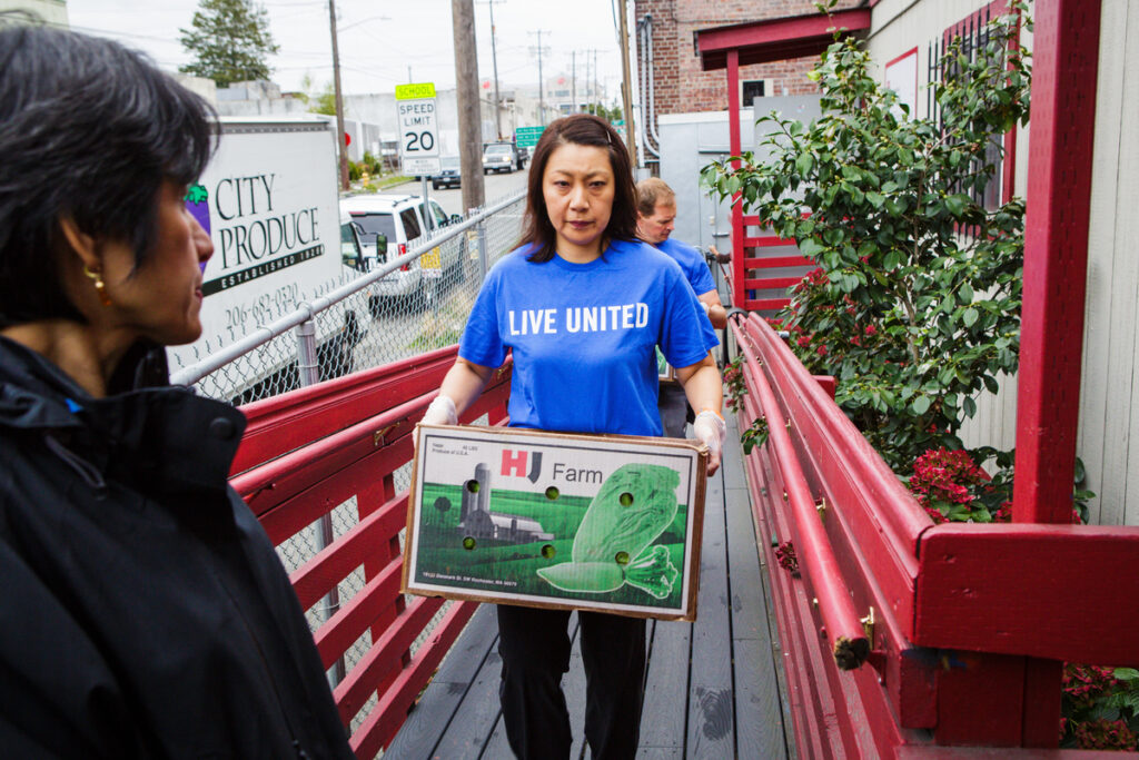 Gates Foundation staff providing volunteer support to ACRS in Seattle, WA.