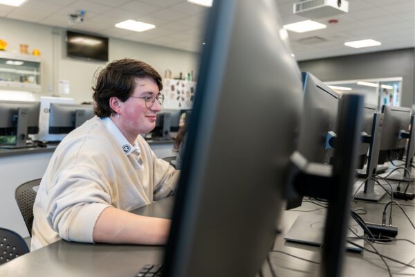 Person working at a computer in a lab setting.