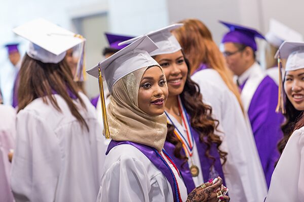 Seattle students in graduation robes.