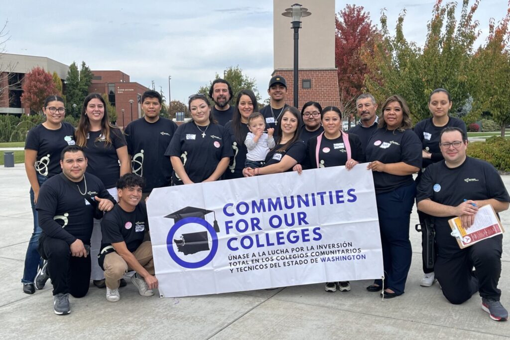 Student leaders holding a banner of Communities for Our Colleges