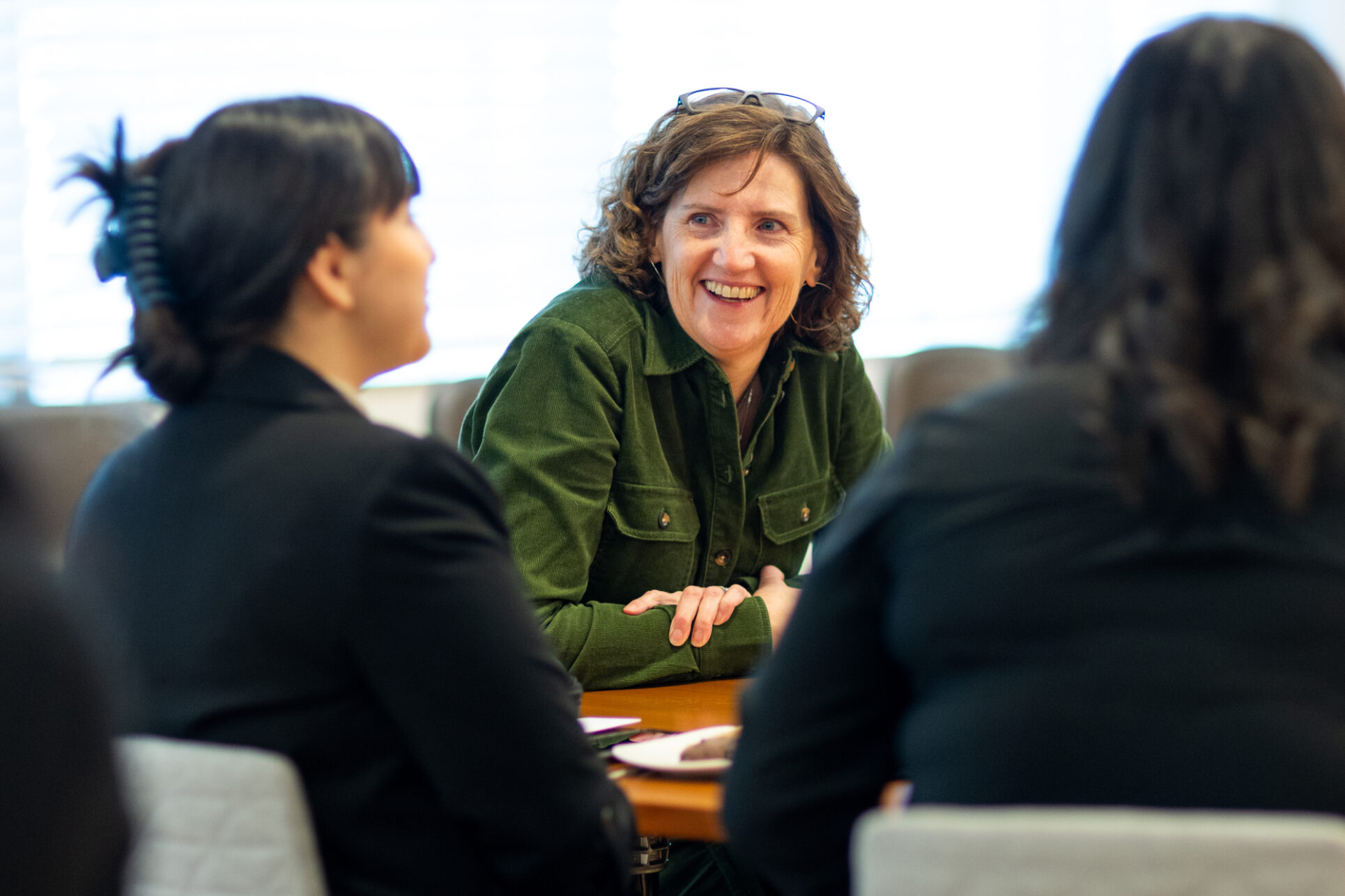 Kathleen Walsh, deputy director of strategy, planning, and management, meets with students during an event at the Gates Foundation